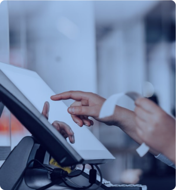 a person is using a pos machine in a store